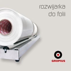 rozwijarka do foli dla bibliotek z rolkami na którym leży folia, podajnik pomaga rozwijać folię do okładania książek